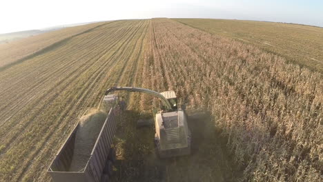 harvesting crops on vast farmlands aerial view