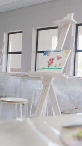 video of school class with easels prepared for art lessons