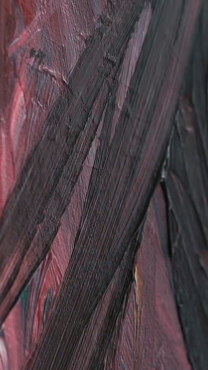 Drawing of black smears on canvas fixed on easel with colorful painting using brush at art lesson in contemporary studio extreme closeup slow motion