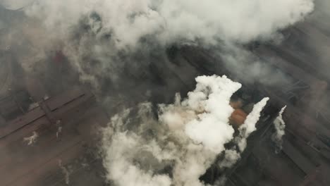 aerial view of an industrial pipe pollutes the air next to people living in the city. create a greenhouse effect