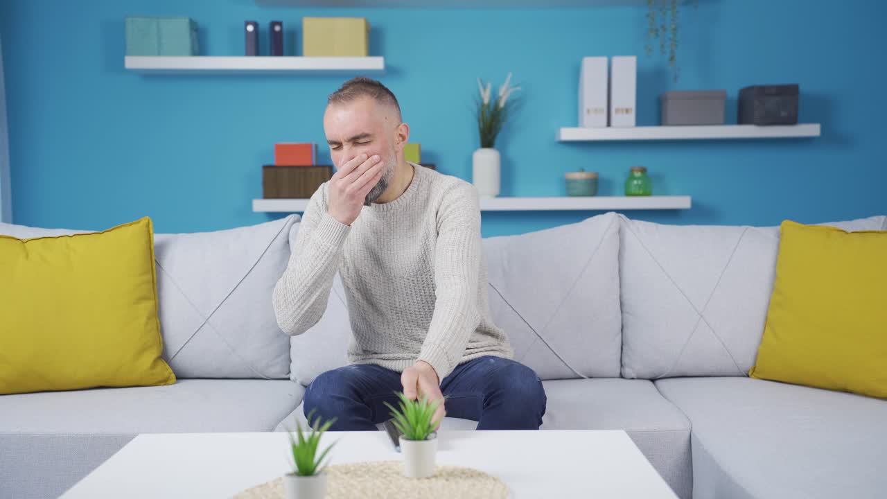 Man feeling bad smell at home.