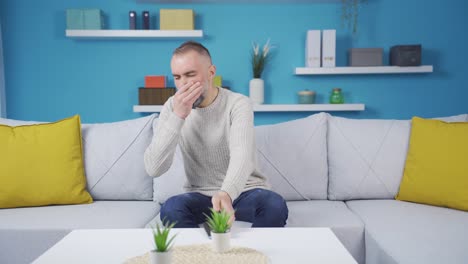 man feeling bad smell at home.