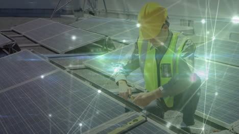 solar energy technician kneeling on roof connecting panel wiring, glowing network nodes overlaying