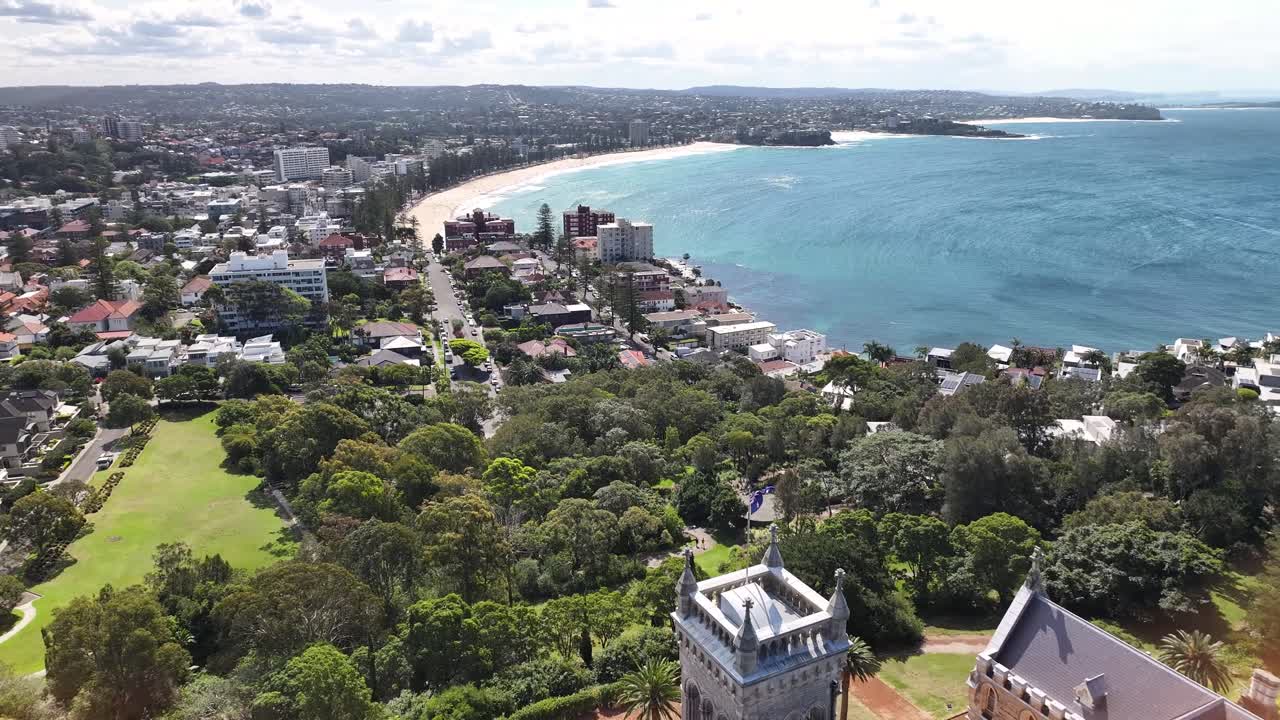 Aerial View of a Coastal City with a Large Mansion