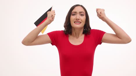 woman holding german flag with changing emotions from worry to excitement, isolated on white