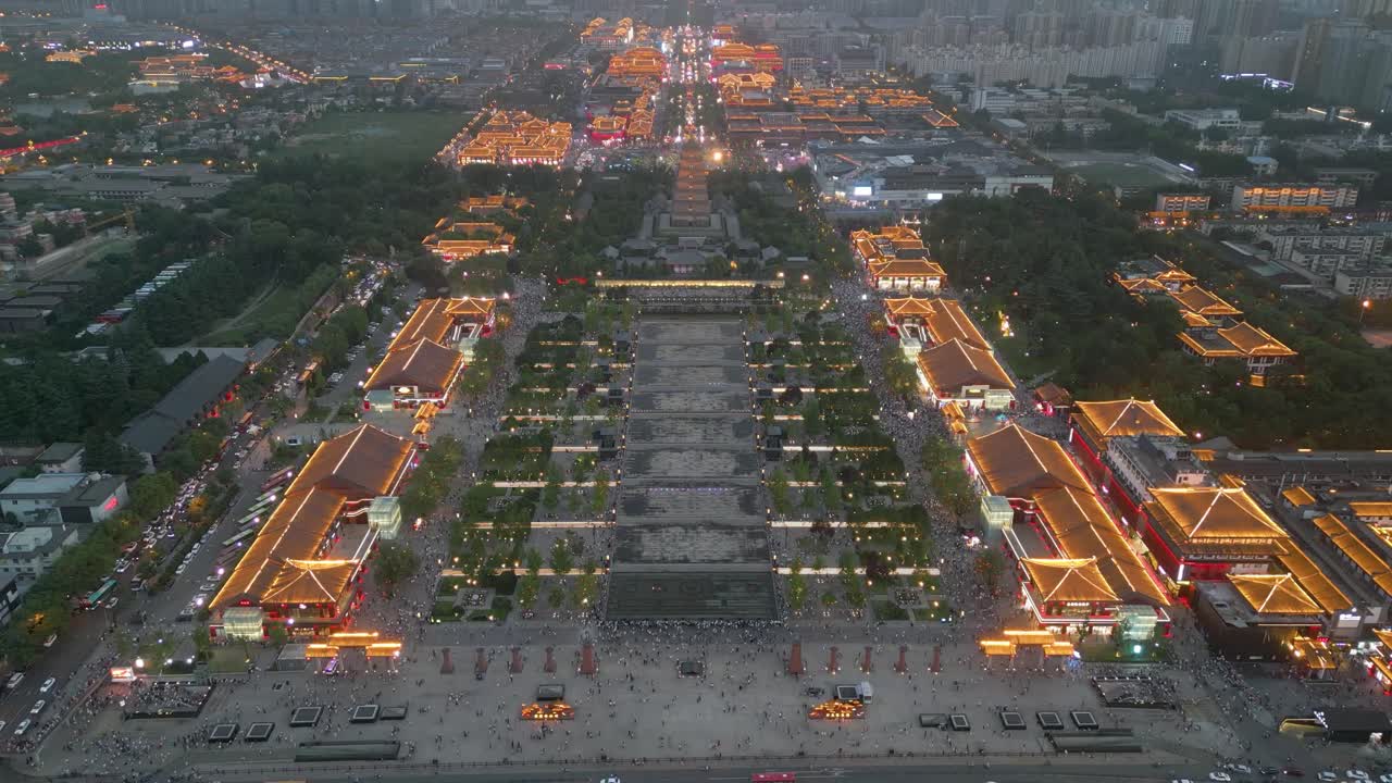 vista aérea de drones de la vigilancia de la vibrante ciudad de datang everbright al anochecer con una hermosa iluminación