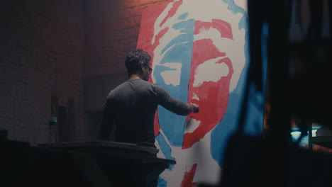 artist painting a portrait in a studio