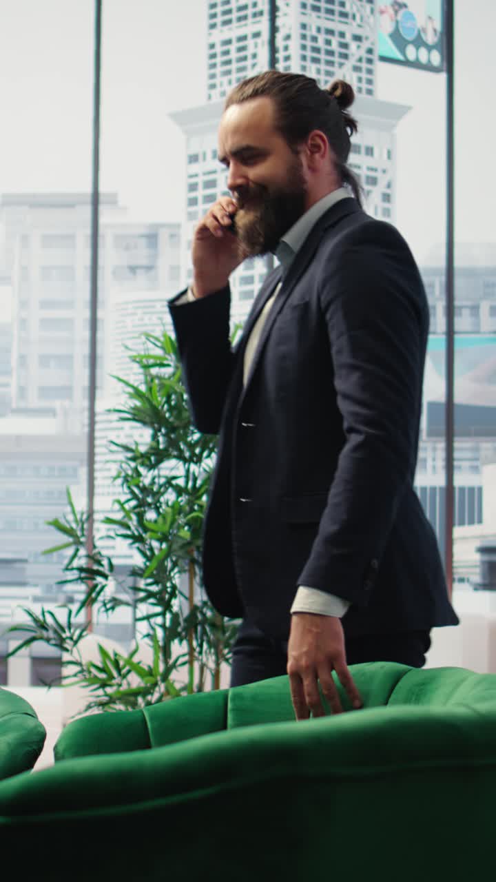 Vertical Video CEO multitasking and managing an important phone call with investors