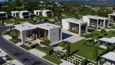 collection of modern luxury homes with manicured gardens and scenic surroundings