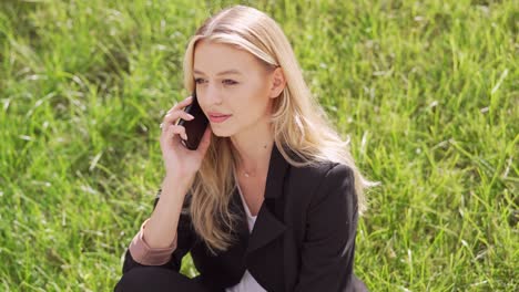woman talking on phone outdoors
