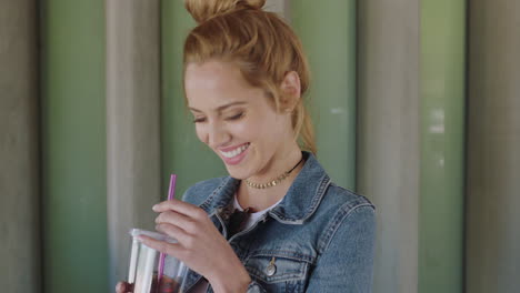 portrait of young red head woman student happy drinking iced coffee