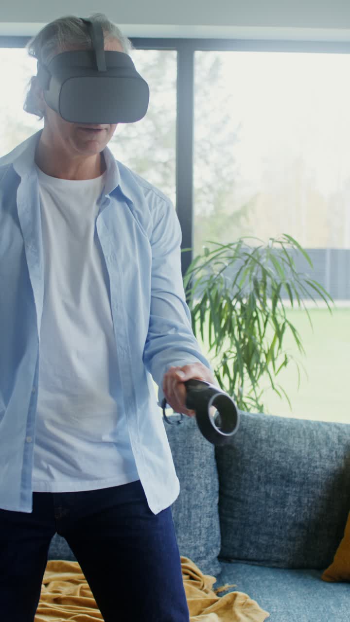 Senior Man Enjoys Virtual Reality Experience at Home
