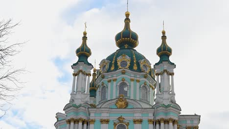 low-angle view of the iconic turquoise and gold domes of st. andrew's church, a masterpiece of baroque architecture in kyiv, ukraine. an exterior view of the famous historical landmark