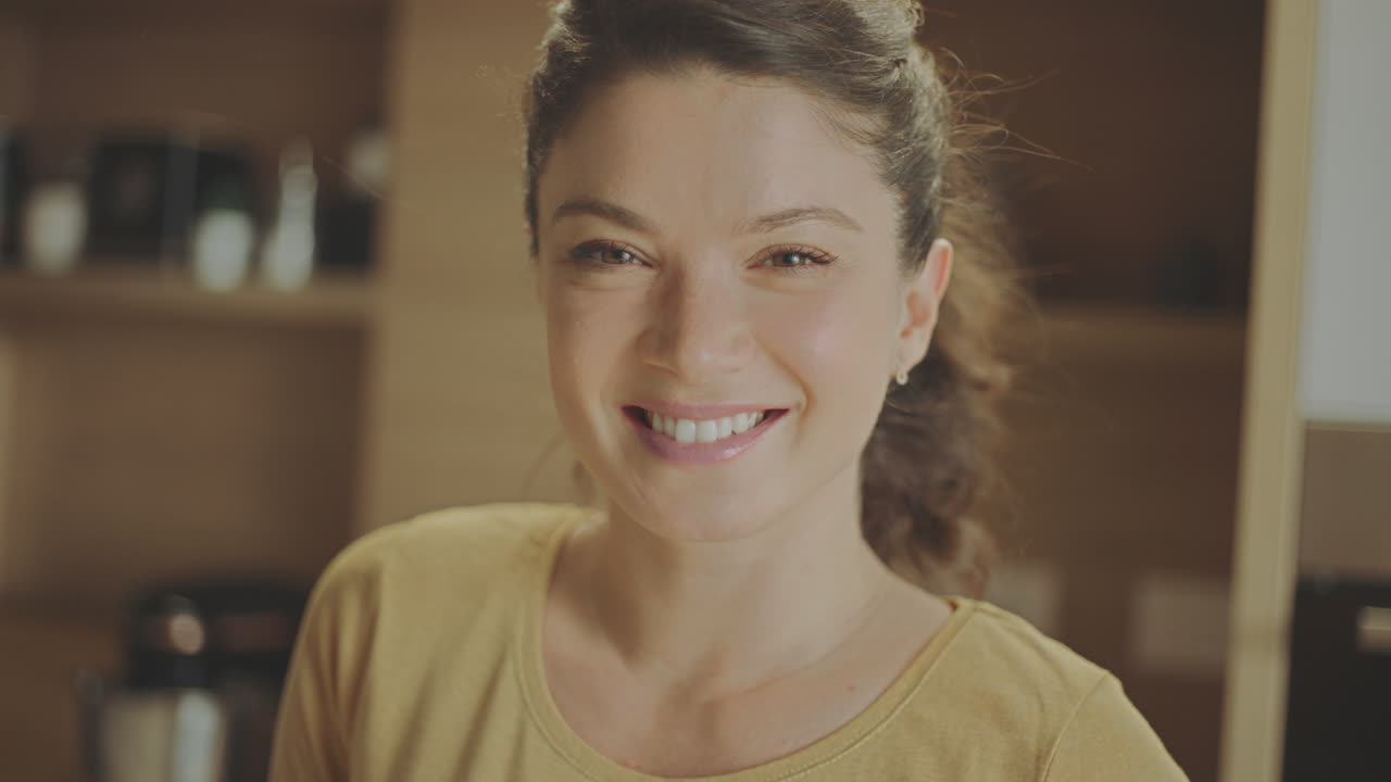Smiling Woman in Kitchen