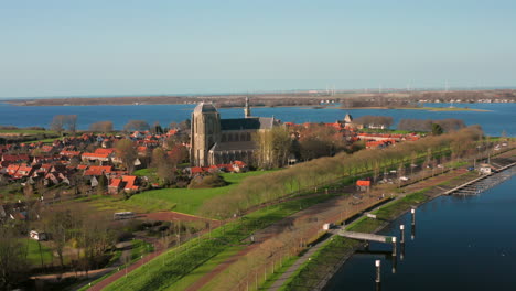 aerial: the historical town of veere with an old harbour and churches, on a spring day