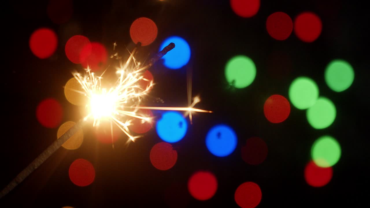 Christmas sparkler. On a black background.