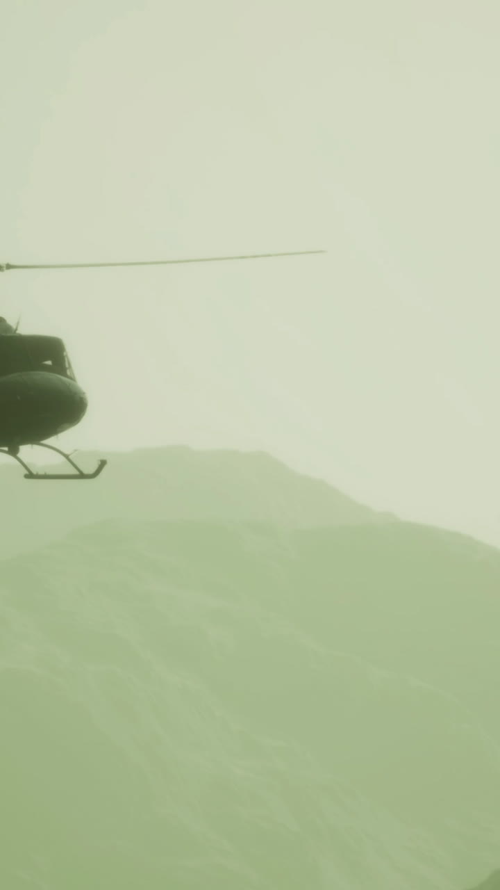 Helicopter soaring over misty mountains at dawn during a tranquil morning