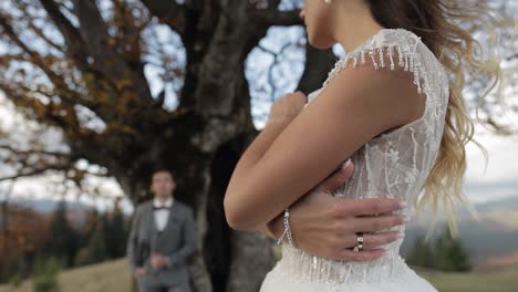 lovely caucasian wedding couple newlyweds family bride groom stay together on mountain slope hill