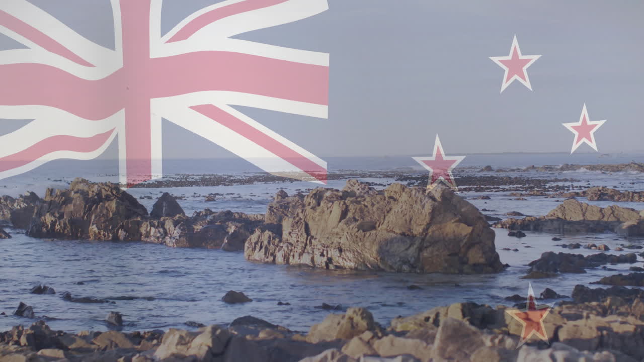 New Zealand flag animation over rocky coastal landscape with calm sea