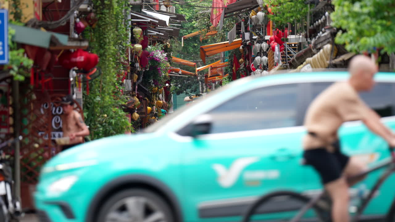 Vibrant Street Scene in Hanoi, Vietnam with Train Tracks