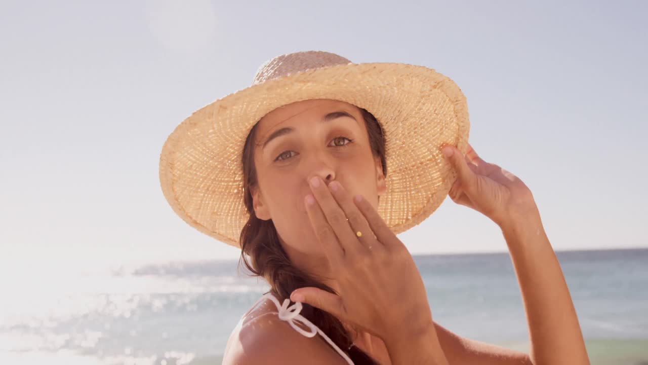 Happy woman blowing a kiss