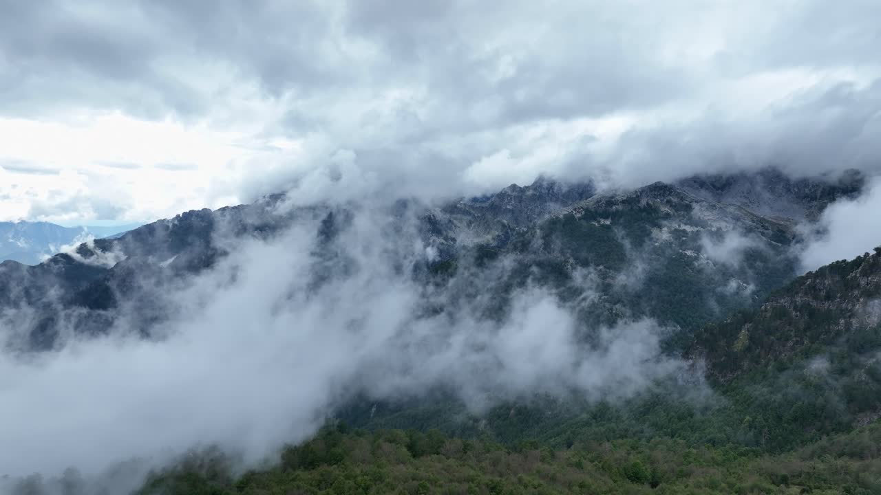 Front view of an incredible day with clouds near the mountains in Teth National Park, Albania