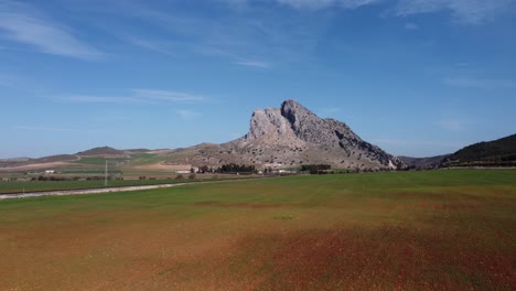Spectacular aerial flight over the enclave of Pe&ntilde;a de los Enamorados, a rock formation in the shape of a human face in the municipality of Antequera in Andalusia, Spain