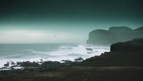 Wide-shot-of-stormy-seas-around-Ponta-dos-Capelinhos,-Faial,-Azores