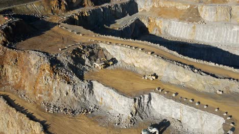 n aerial overview of a limestone quarry: heavy equipment at work to extract valuable resources in germany