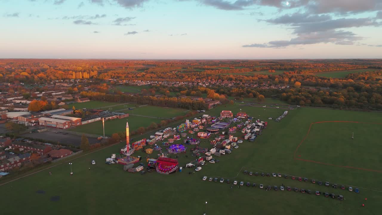 Fairground at sunset in Thetford, Norfolk, aerial view