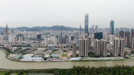 aerial view over shenzhen cityscape with massive urban development and skyscrapers