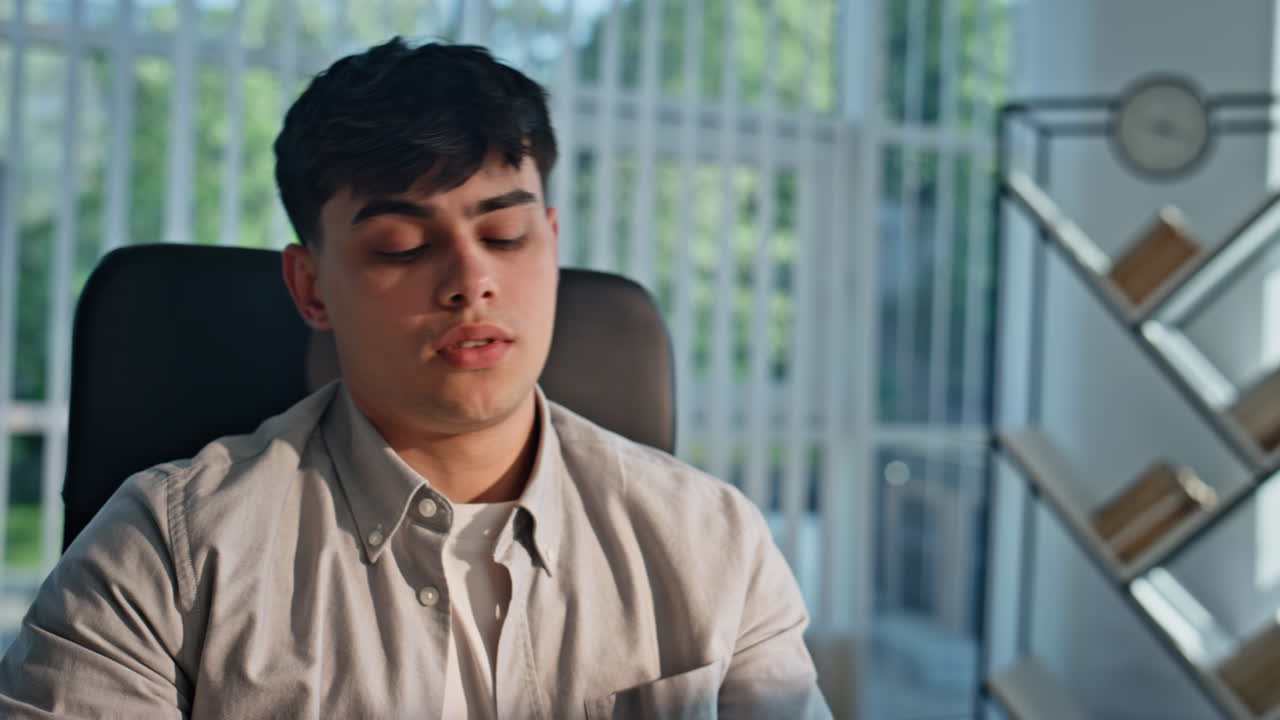 Exhausted man reading papers working in office portrait. Tired manager paperwork