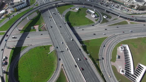 an aerial view of a ring road junction on a sunny day