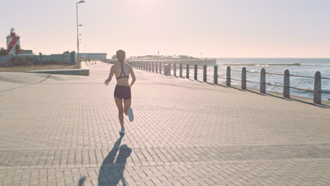 woman running on a coastal path