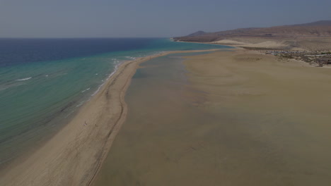 sotavento beach, fuerteventura: wonderful aerial view traveling in on the shore of the fantastic beach, on a sunny day