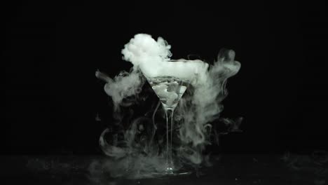 drink in glass of martinis with the effect of dry ice
