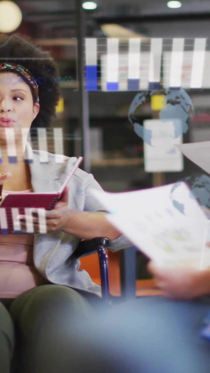 Animation of financial data processing over diverse creative business people in office