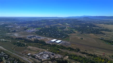 castle rock sedalia pikes peak deckers aerial drone colorado front range morning neighborhood homes businesses blue sky daniels park castle pines village winter spring forward down