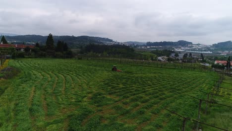 tractor farms the green field aerial view