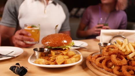 friends enjoying a meal together at a restaurant