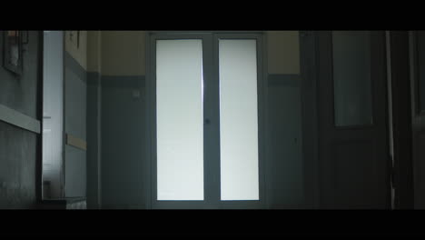 a girl runs through strange corridors of abandoned hospital