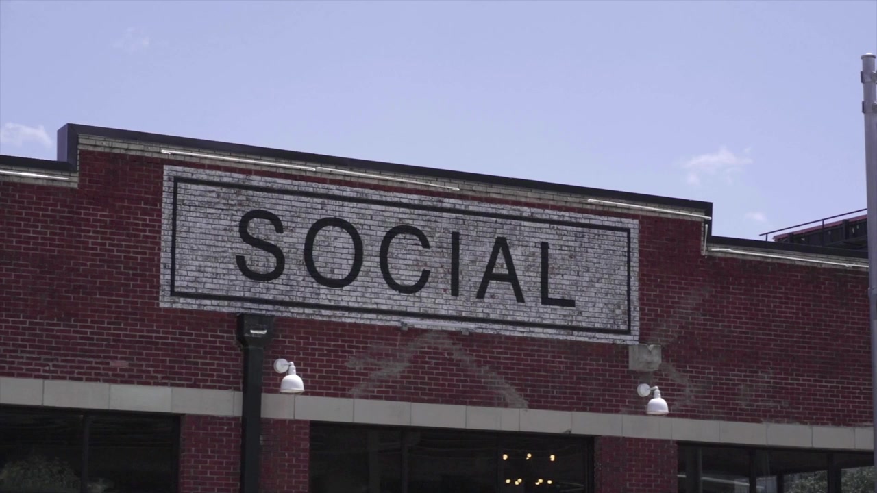 Old abandoned store front with associated store words on the front