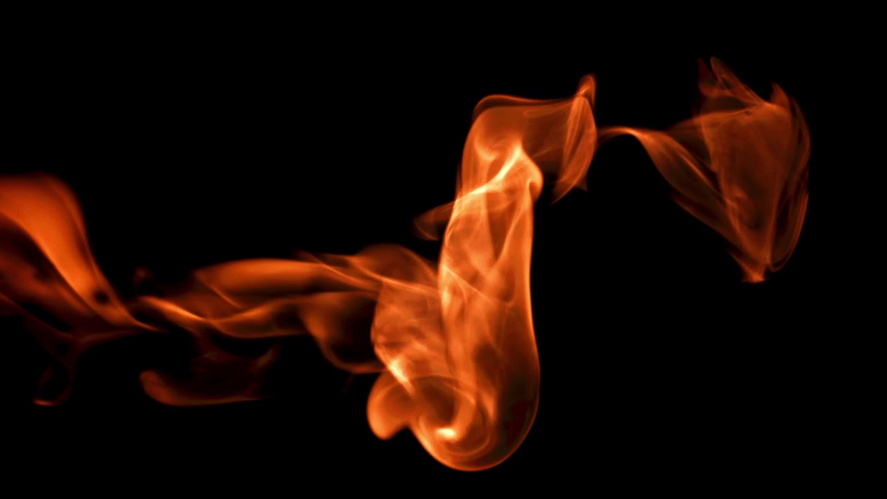 Abstract Orange and Red Smoke Flowing on Black Background