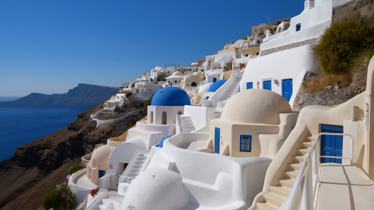 Iconic Whitewashed Buildings and Blue Domes of Santorini Overlooking the Aegean Sea