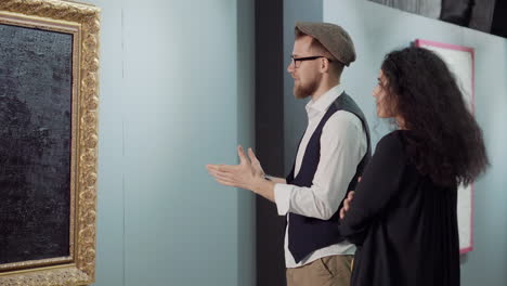 couple viewing abstract art in an art gallery