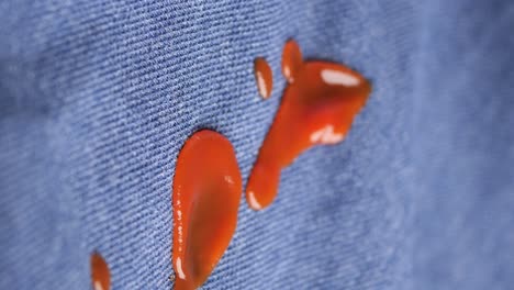 red sauce stain on denim