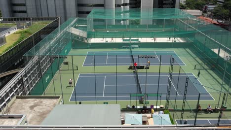 tennis class in a roof court