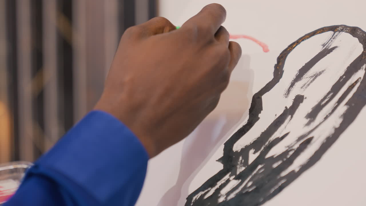 Sketching with bold strokes. Expressive monochrome drawing captured in detailed studio setting. Skilled artist using charcoal to craft textured monochrome artwork in focused studio environment