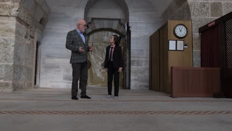 Grandfather-and-grandson-touring-in-mosque