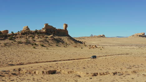 aerial orbiting vehicle in dramatic desert landscape in new mexico usa